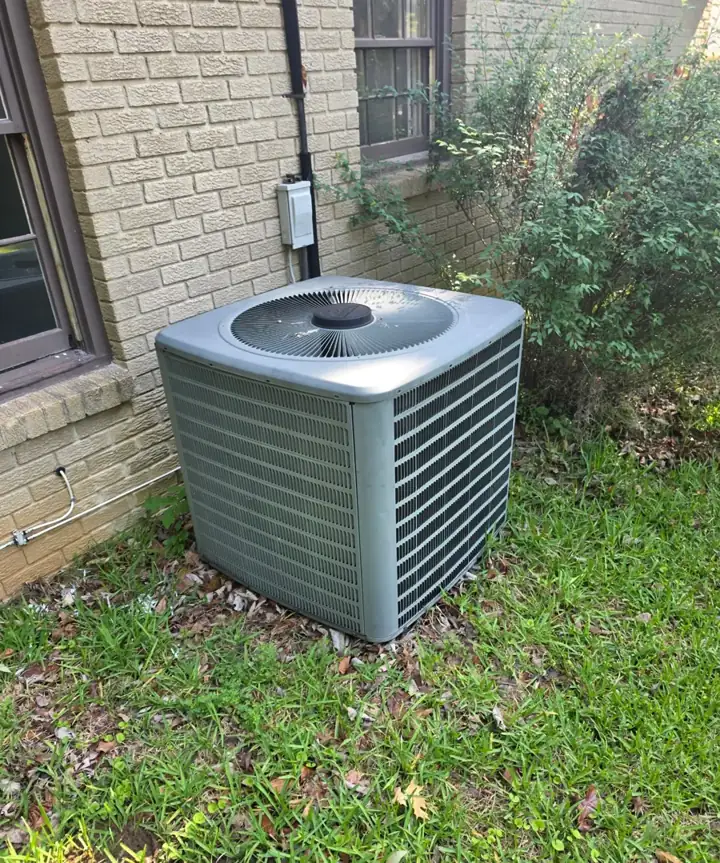 Aging central air conditioner condenser before replacement at a River Region home